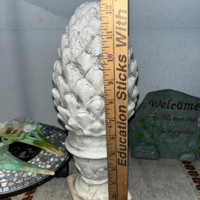 Sale Photo Thumbnail #110: Concrete statue, mosaic plant holder on wheels, garden rock and stakes, small planter with shoe holders