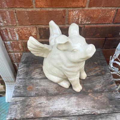 Sale Photo Thumbnail #380: Ceramic pig with wings statue