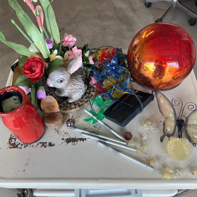 Sale Photo Thumbnail #640: Rabbit floral arrangement, gazing ball w/metal stand, solar lights, butterfly windchime and more