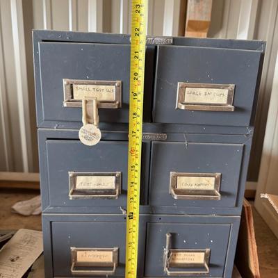 Sale Photo Thumbnail #3: Industrial metal storage drawers labeled for hardware and components. Perfect for garages, workshops, or craft storage.