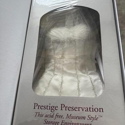 Sale Photo Thumbnail #17: Gorgeous beaded wedding gown preserved in a “Prestige Preservation” acid-free museum-style storage box. Condition not removed for inspection.