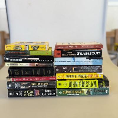 Sale Photo Thumbnail #21: Mix of fiction, faith, and thrillers including Grisham, Cussler, Albom, and more. Includes two Bibles. Some paperback wear but great reads.