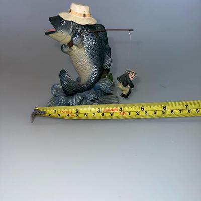 Sale Photo Thumbnail #52: Large-mouth bass with a hat and fishing pole. Humorous and detailed resin sculpture.