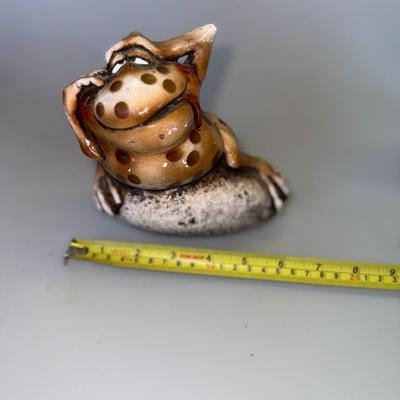 Sale Photo Thumbnail #60: Chunky, quirky frog sculpture with laid-back attitude. Ceramic.