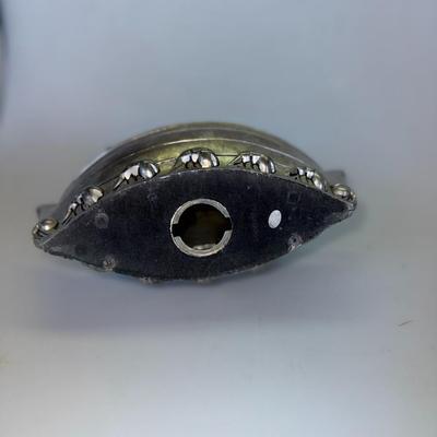 Sale Photo Thumbnail #71: Metal coin bank in the shape of Noah’s Ark with engraved animal details.