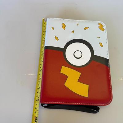 Sale Photo Thumbnail #76: Includes 1 opened Pikachu binder and 2 sealed binders with themed artwork. Holds card sleeves.