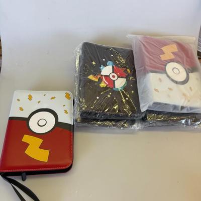 Sale Photo Thumbnail #74: Includes 1 opened Pikachu binder and 2 sealed binders with themed artwork. Holds card sleeves.