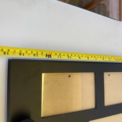Sale Photo Thumbnail #99: Black wood composite frame with mirror center, photo slots, and 4 coat hooks.