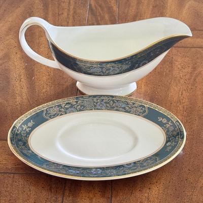 Sale Photo Thumbnail #73: Royal Doulton Carlyle pattern gravy boat and plate. Dimensions: Gravy bowl: 9”w x 3:5”d 
Gravy plate 5.6”w x 8.5”l. In very good/excellent condition.