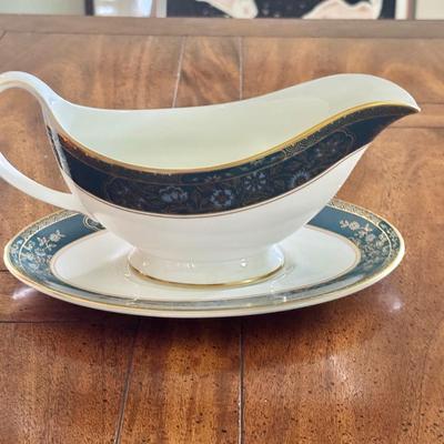 Sale Photo Thumbnail #72: Royal Doulton Carlyle pattern gravy boat and plate. Dimensions: Gravy bowl: 9”w x 3:5”d 
Gravy plate 5.6”w x 8.5”l. In very good/excellent condition.