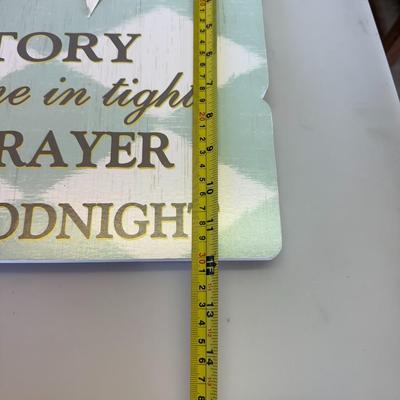 Sale Photo Thumbnail #115: Description: Charming wooden sign with pastel tones and raised bunting. Features bedtime phrase: "Read me a story, tuck me in tight..."