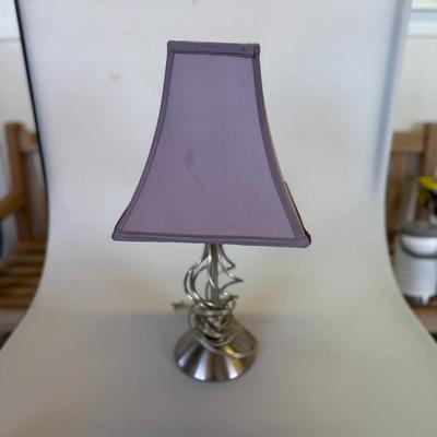 Sale Photo Thumbnail #123: Brushed silver-tone table lamp with lavender shade and modern spiral base.