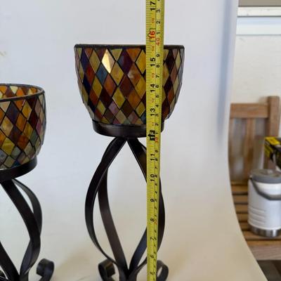 Sale Photo Thumbnail #125: Set of two mosaic-style glass candle holders on tall black wrought iron stands.