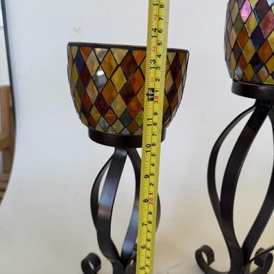 Sale Photo Thumbnail #126: Set of two mosaic-style glass candle holders on tall black wrought iron stands.