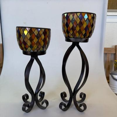 Sale Photo Thumbnail #124: Set of two mosaic-style glass candle holders on tall black wrought iron stands.