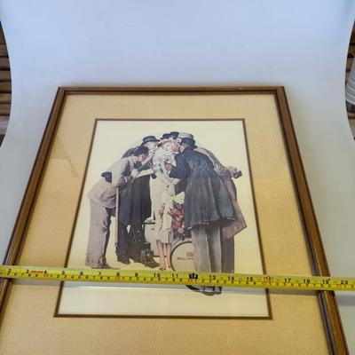 Sale Photo Thumbnail #132: Framed color print of a group of men surrounding a young girl with a drum. Warm-toned frame and textured mat.