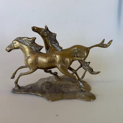 Sale Photo Thumbnail #163: Vintage brass sculpture of two galloping horses. Heavy and detailed. Great for Western or equine collectors.