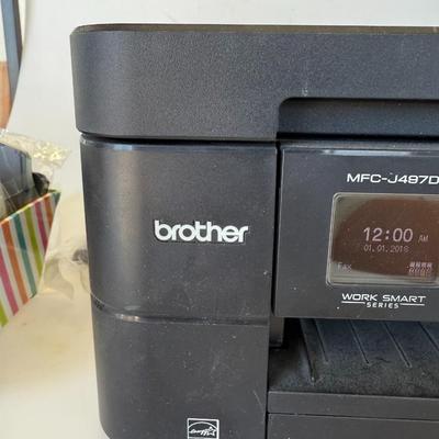 Sale Photo Thumbnail #192: Reliable all-in-one printer/copier/scanner/fax. Includes a bonus basket of ink cartridges. Powers on, untested.