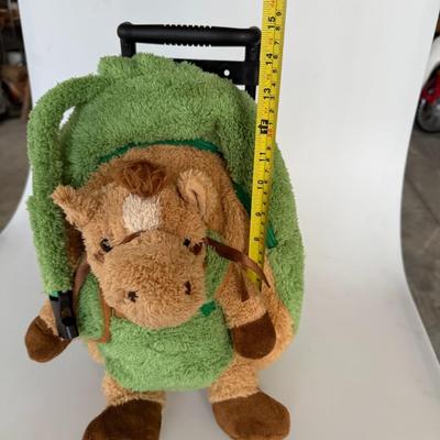 Sale Photo Thumbnail #206: Soft green plush backpack with horse stuffed animal face and wheels/trolley handle. Cute and functional for preschoolers or as a toy storage pack.