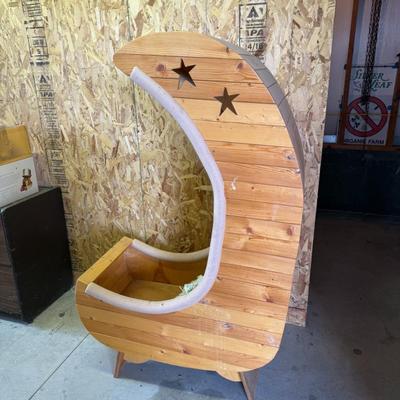 Sale Photo Thumbnail #213: Handcrafted wooden bookshelf shaped like a crescent moon with star cutouts. Whimsical and ideal for a nursery or themed room. Needs light cleaning.