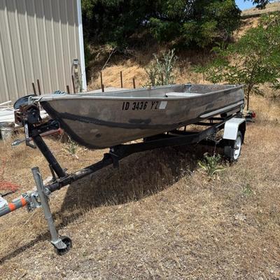 Sale Photo Thumbnail #219: Flat-bottom aluminum fishing boat with trailer. Rough condition, needs some work.