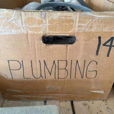 Sale Photo Thumbnail #234: Assorted plumbing parts including hoses, drain couplings, PVC fittings, and valves. Mixed new and used condition. Ideal for repairs or repurposing.