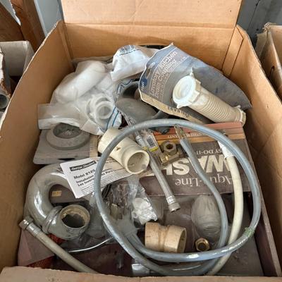 Sale Photo Thumbnail #235: Assorted plumbing parts including hoses, drain couplings, PVC fittings, and valves. Mixed new and used condition. Ideal for repairs or repurposing.