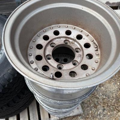 Sale Photo Thumbnail #249: Four rugged aluminum rims for heavy-duty trucks or off-road vehicles. Some oxidation, but structurally sound.