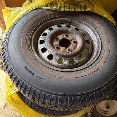 Sale Photo Thumbnail #250: steel-belted radial tires mounted on used steel rims. Tread appears decent.