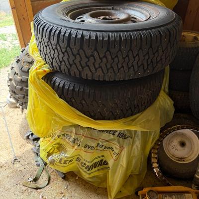 Sale Photo Thumbnail #251: steel-belted radial tires mounted on used steel rims. Tread appears decent.