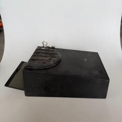 Sale Photo Thumbnail #264: Compact black locking cash or storage box with key included. Great for securing petty cash, keys, or small valuables.