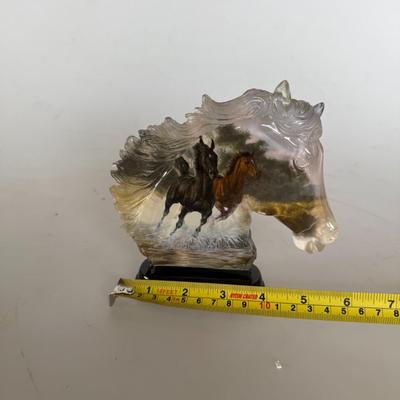 Sale Photo Thumbnail #292: Resin horse head sculpture with embedded imagery of running horses. Labeled “Thundering Elegance.”