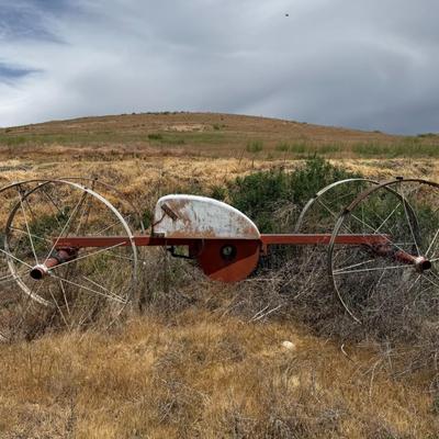 Sale Photo Thumbnail #366: Antique/industrial irrigation wheel system with large steel wheels and metal frame. Great as a statement yard piece or repurposed decor.