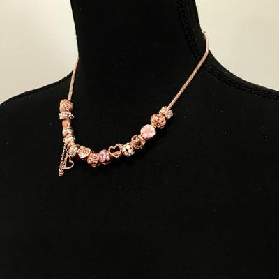 Beautiful rose, gold, toned charm bead necklace very nice
