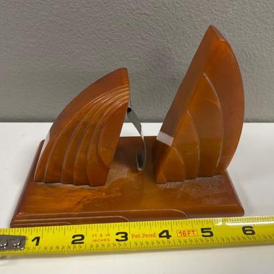Sale Photo Thumbnail #159: In very good shape art deco Bakelite letter paper holder in dark amber color