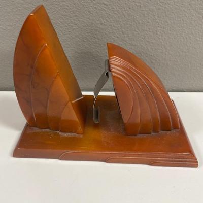 Sale Photo Thumbnail #157: In very good shape art deco Bakelite letter paper holder in dark amber color