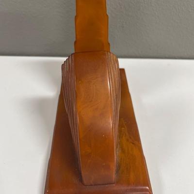Sale Photo Thumbnail #158: In very good shape art deco Bakelite letter paper holder in dark amber color