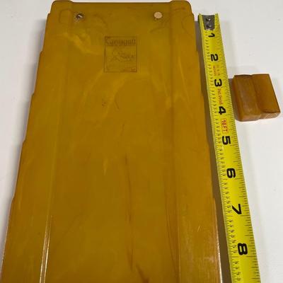 Sale Photo Thumbnail #163: Art Deco Butterscotch Amber by Carvacraft Bakelite Notepad 
Has 2 small pieces that were with item at pick up but do not believe they are missing from the notepad