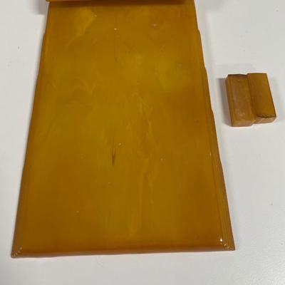 Sale Photo Thumbnail #161: Art Deco Butterscotch Amber by Carvacraft Bakelite Notepad 
Has 2 small pieces that were with item at pick up but do not believe they are missing from the notepad