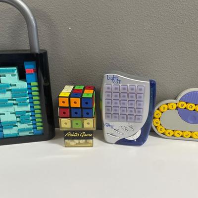 Sale Photo Thumbnail #235: Lights Out; Rubiks Game and more