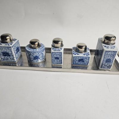 Sale Photo Thumbnail #165: Decorative Metal Tray, Double Handled with 5 Porcelain Jars with Metal Tops

Description: Asian blue and white
Dimensions: Tray – 24x1x7, largest jar – 5.5x4.5x2
Damage: Normal wear