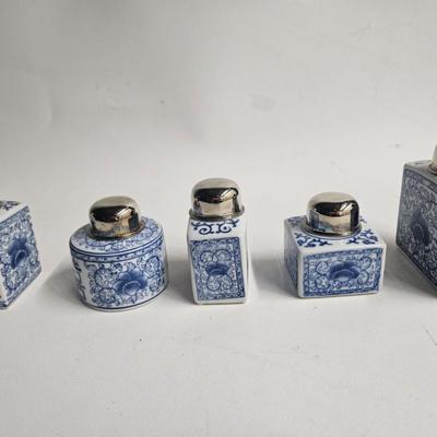 Sale Photo Thumbnail #169: Decorative Metal Tray, Double Handled with 5 Porcelain Jars with Metal Tops

Description: Asian blue and white
Dimensions: Tray – 24x1x7, largest jar – 5.5x4.5x2
Damage: Normal wear