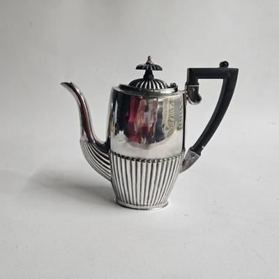 Sale Photo Thumbnail #176: Cheltenham & Co. Sheffield England, Vintage Silver-plate Tea/Coffee Pot, Art Deco

Dimensions: 8x8.5x3
Damage: Normal wear, small dent in the side, looks to be silver polish residue in some crevasses