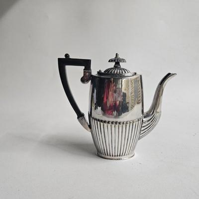 Sale Photo Thumbnail #177: Cheltenham & Co. Sheffield England, Vintage Silver-plate Tea/Coffee Pot, Art Deco

Dimensions: 8x8.5x3
Damage: Normal wear, small dent in the side, looks to be silver polish residue in some crevasses