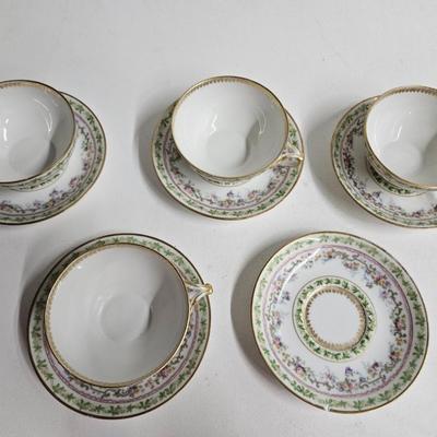 Sale Photo Thumbnail #188: Set of PR France Porcelain Teacups & Saucers

Description: 5 saucers, 4 cups
Dimensions: Saucer – 1x5x5, Cup – 1.5x4.5x4
Damage: 1 saucer has a chip in the rim