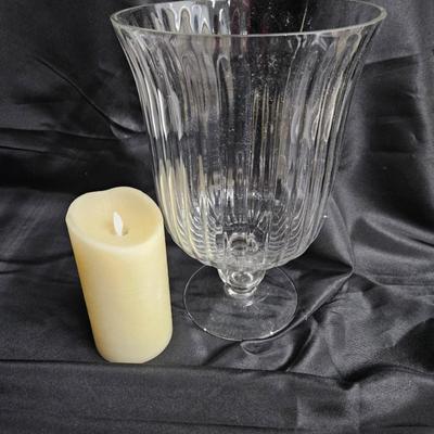Sale Photo Thumbnail #199: Large Glass Hurricane Vase

Description: Comes with a battery-operated candle
Dimensions: 13x8.5x8.5
Damage: Normal wear