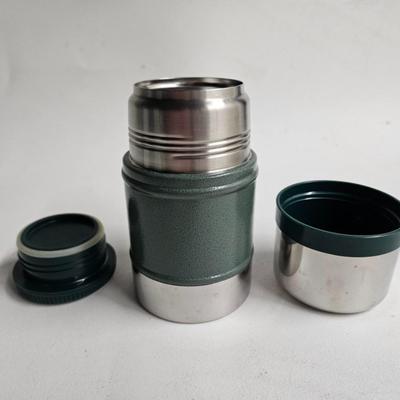 Sale Photo Thumbnail #220: DM65. Stanley Classic Vacuum Food Jar, hot/cold, Classic Green

Dimensions: 12x15x1
Damage: Normal wear