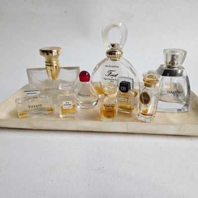 Sale Photo Thumbnail #245: DM70. Lot of Perfume Bottles on a Capiz Shell Tray

Dimensions: 24x36
Damage: Normal wear