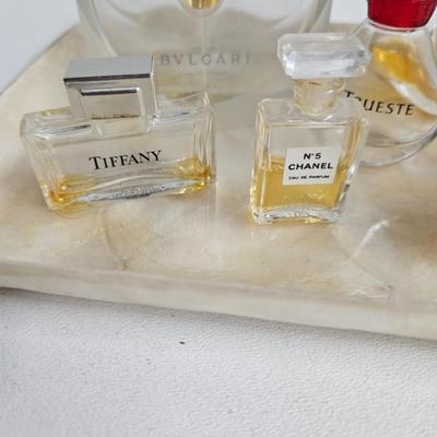 Sale Photo Thumbnail #248: DM70. Lot of Perfume Bottles on a Capiz Shell Tray

Dimensions: 24x36
Damage: Normal wear
