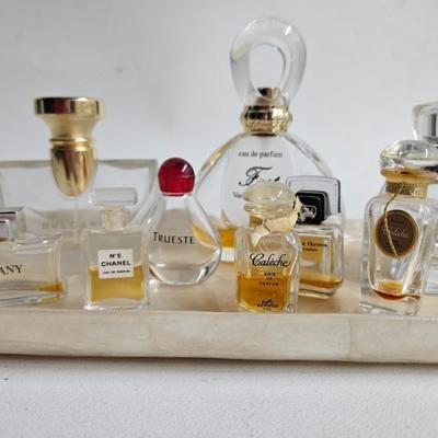 Sale Photo Thumbnail #247: DM70. Lot of Perfume Bottles on a Capiz Shell Tray

Dimensions: 24x36
Damage: Normal wear
